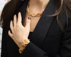 Bracciale ottone finitura oro con occhio di gatto arancio Sovrani
